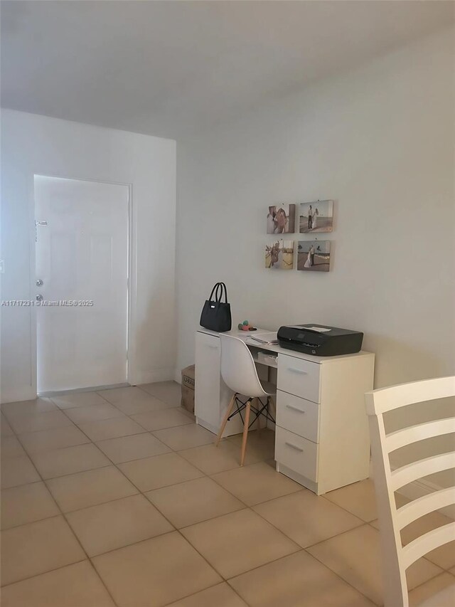 office area with light tile patterned floors