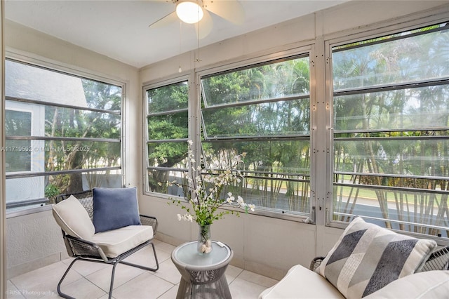 sunroom / solarium featuring ceiling fan