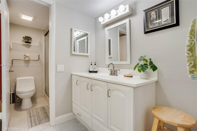 bathroom with toilet, vanity, tile patterned floors, and an enclosed shower