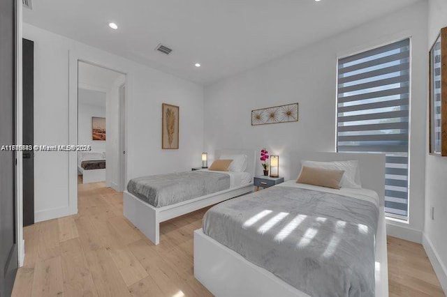 bedroom with light wood-type flooring