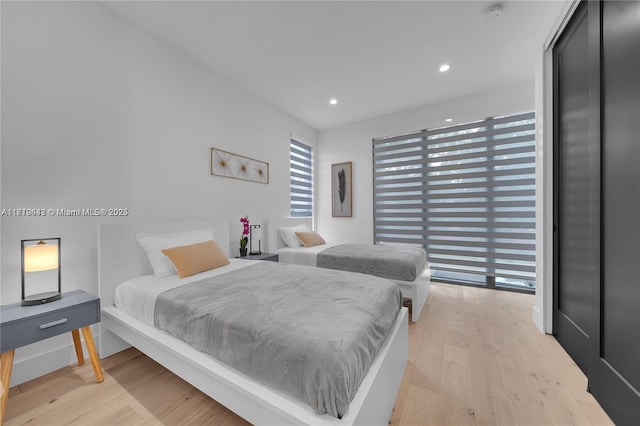 bedroom with light wood-type flooring