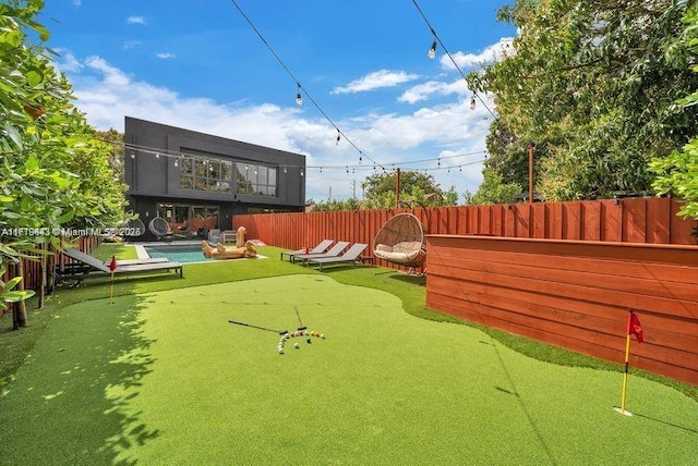 view of yard featuring a pool