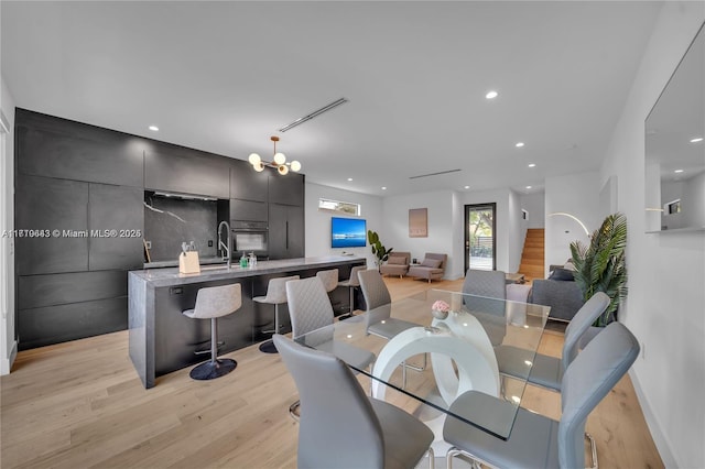 dining area with light hardwood / wood-style floors