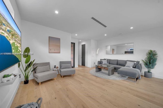 living room with light hardwood / wood-style floors