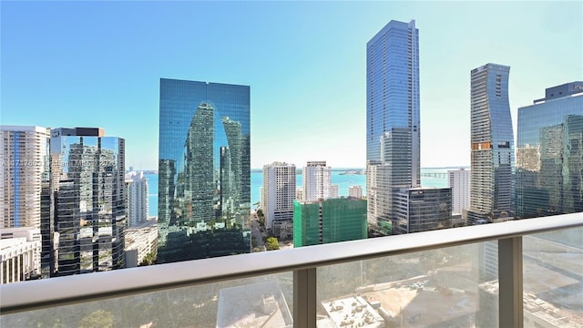 property's view of city featuring a water view