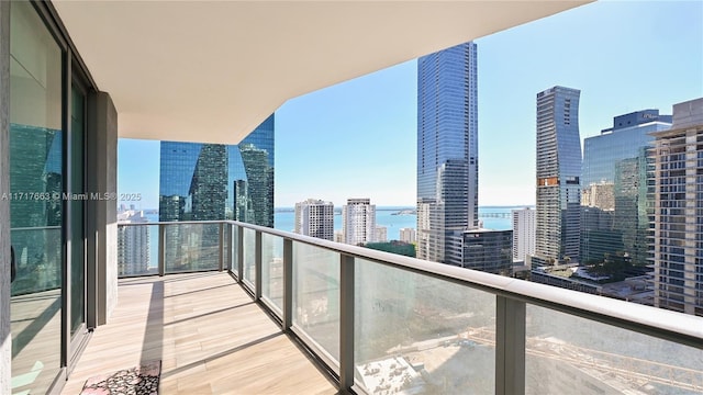 balcony featuring a water view