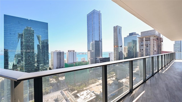 balcony featuring a water view