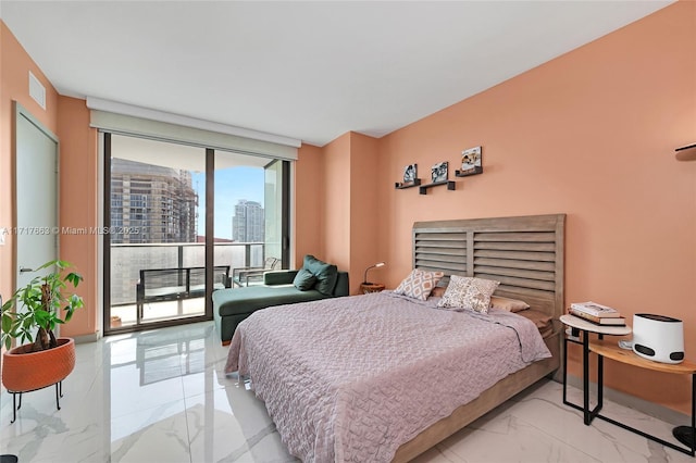 bedroom featuring access to exterior and floor to ceiling windows