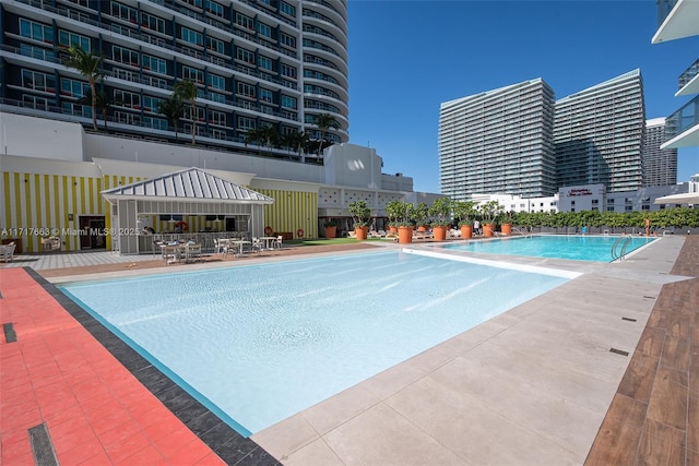 view of swimming pool featuring a patio