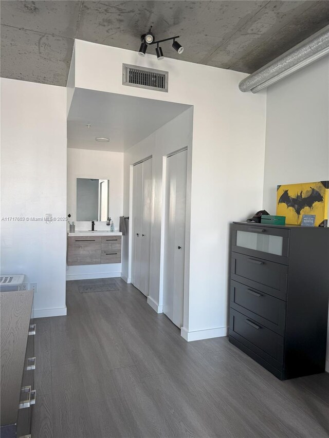 corridor featuring dark hardwood / wood-style floors