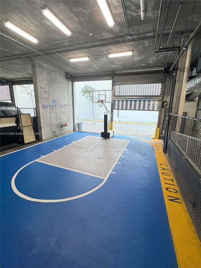 view of basketball court featuring plenty of natural light