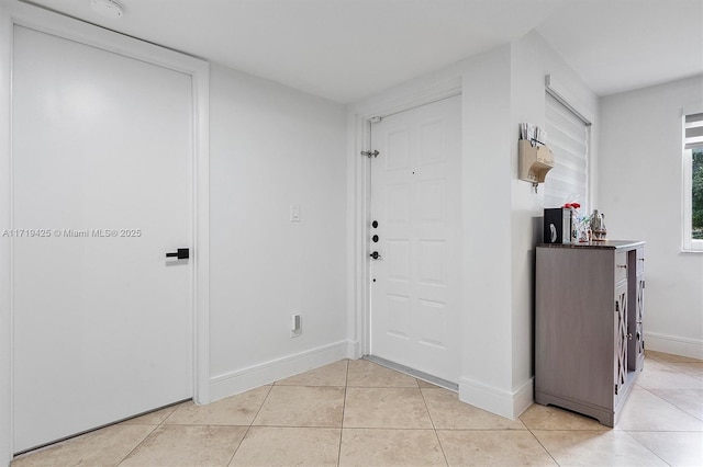 entrance foyer featuring light tile patterned floors