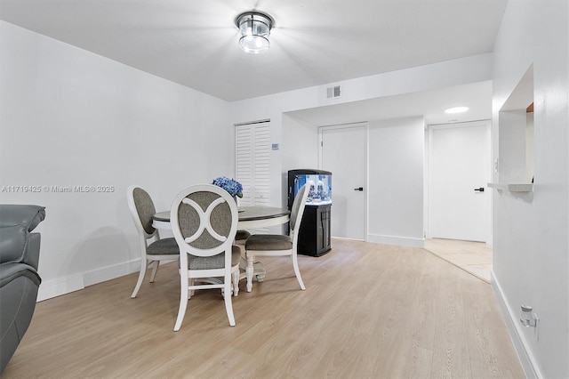 dining area with light wood-type flooring