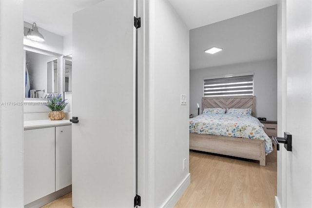 bedroom with light hardwood / wood-style flooring