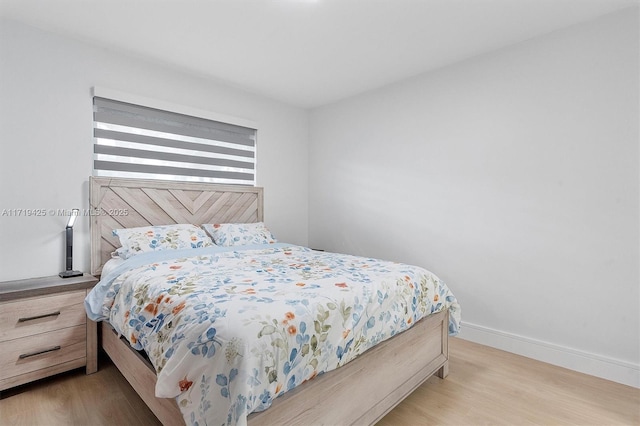 bedroom with light hardwood / wood-style flooring