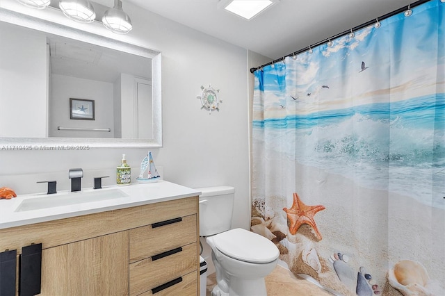 bathroom with vanity, toilet, and walk in shower