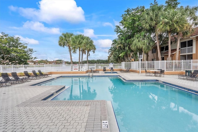 view of swimming pool with a patio area