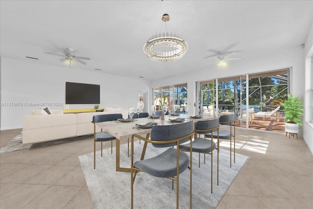 tiled dining space featuring ceiling fan with notable chandelier