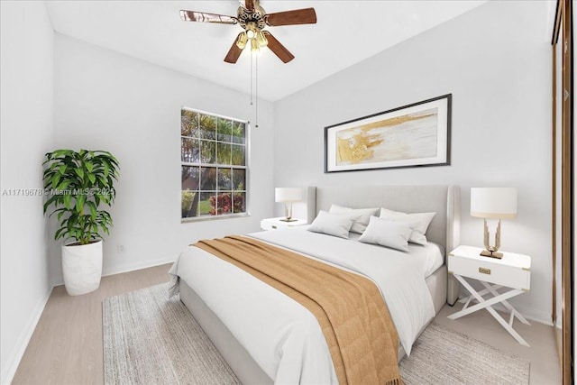 bedroom featuring ceiling fan and light hardwood / wood-style floors