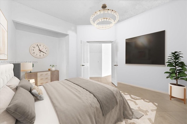 tiled bedroom with a notable chandelier