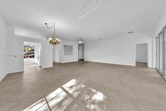 unfurnished living room with ceiling fan with notable chandelier