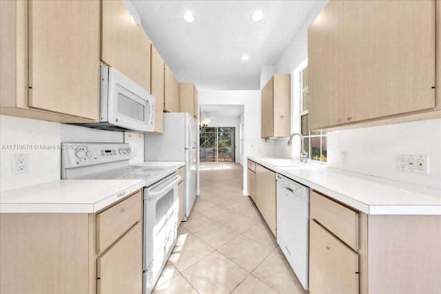 kitchen featuring ceiling fan, sink, light brown cabinets, white appliances, and light tile patterned flooring