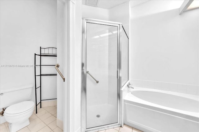 bathroom with toilet, tile patterned flooring, and shower with separate bathtub