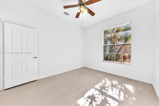 spare room with light hardwood / wood-style floors and ceiling fan