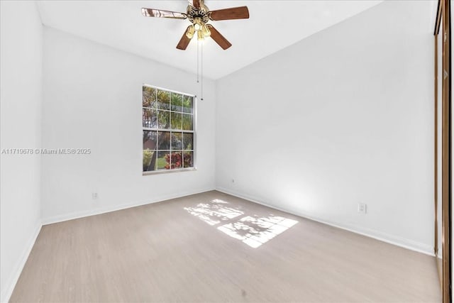 spare room with ceiling fan and light hardwood / wood-style flooring