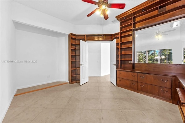 unfurnished bedroom featuring ceiling fan