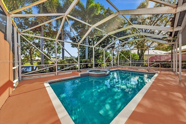 view of pool featuring a lanai, an in ground hot tub, and a patio