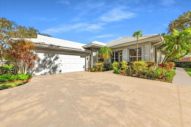 ranch-style house featuring a garage