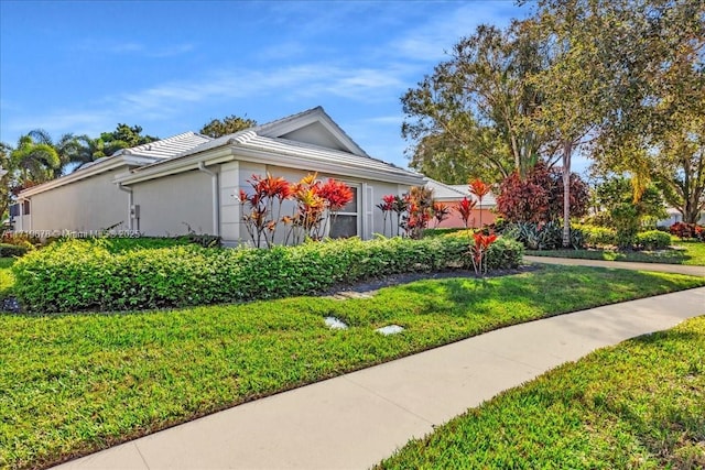 view of property exterior featuring a yard