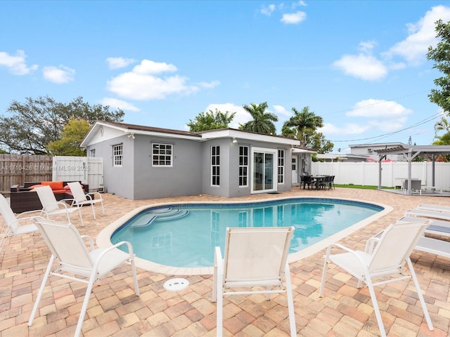 view of swimming pool featuring a pergola and a patio