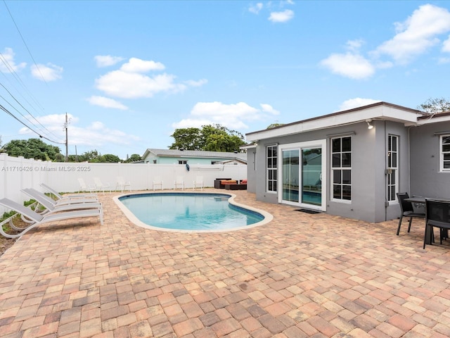 view of pool featuring a patio