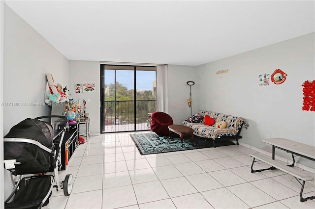 living area featuring light tile patterned floors and expansive windows