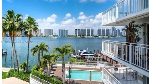 view of swimming pool with a water view