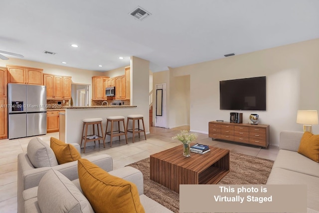 living room featuring light tile patterned floors