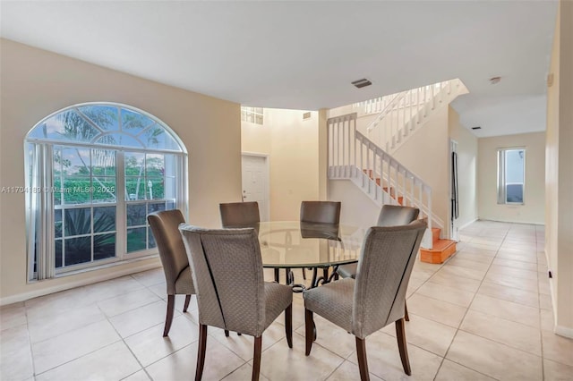 dining area with light tile patterned flooring