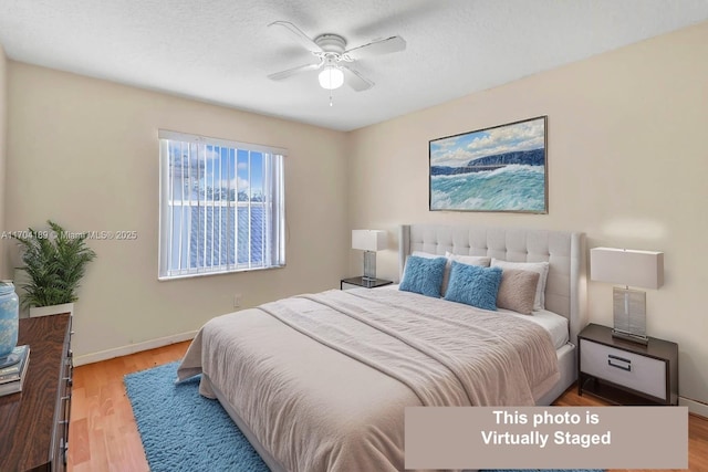 bedroom featuring ceiling fan and light wood-type flooring