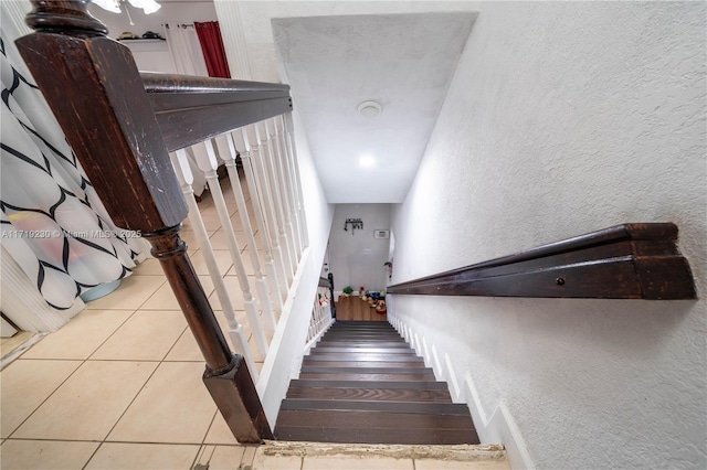 stairs with tile patterned flooring