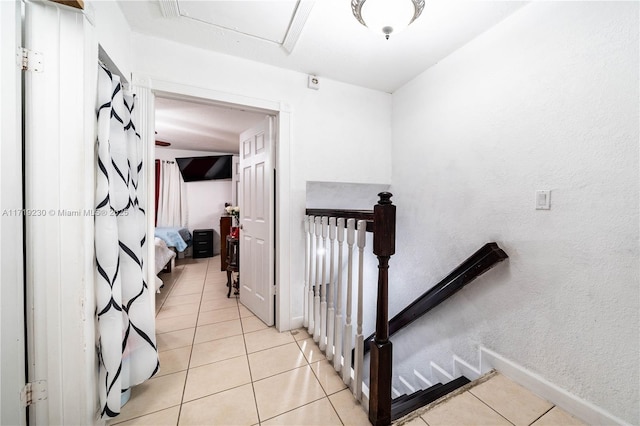 stairs with tile patterned flooring