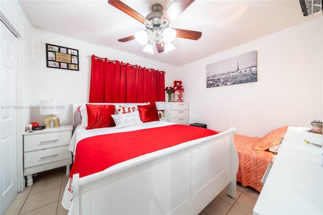 tiled bedroom with ceiling fan