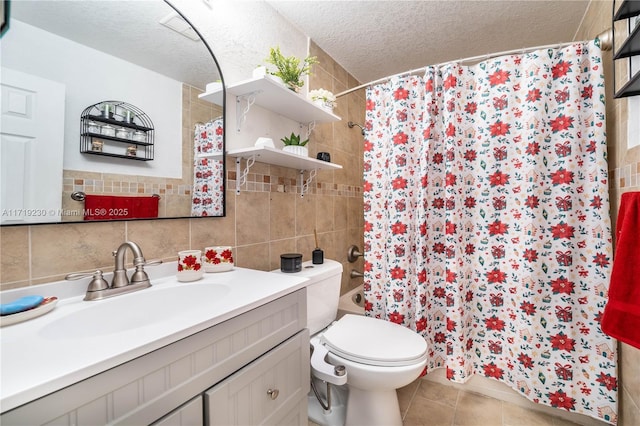 bathroom featuring vanity, tile patterned floors, a shower with curtain, toilet, and a textured ceiling