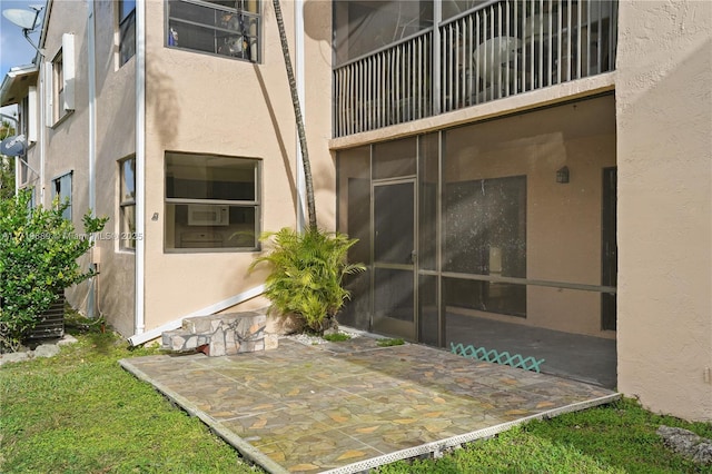 property entrance with a patio