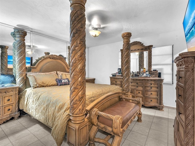 tiled bedroom with ceiling fan