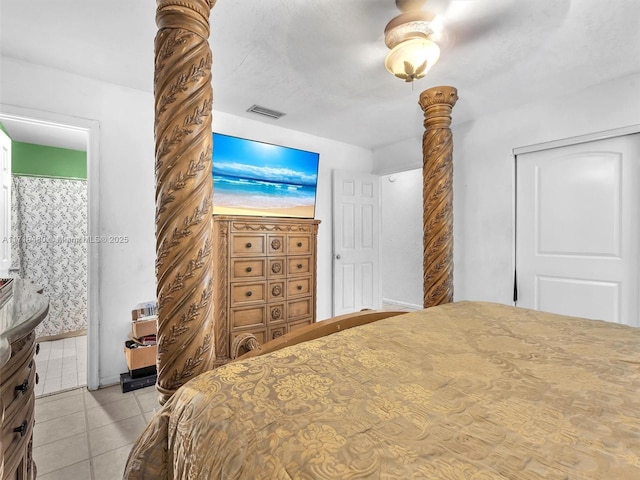 tiled bedroom with ceiling fan