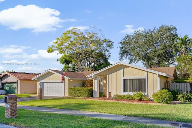 ranch-style house featuring a garage and a front yard