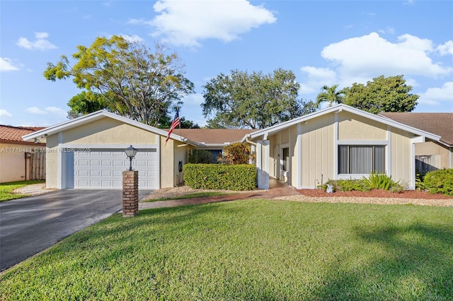 ranch-style house with a garage and a front lawn