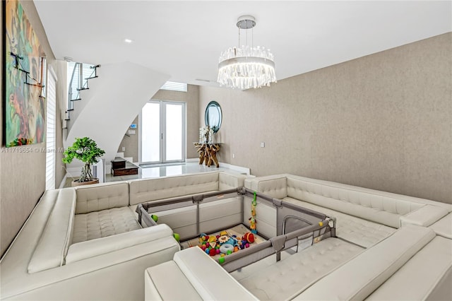 living room with a notable chandelier